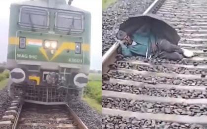 Watch Elderly Man Found Sleeping Under Umbrella on Railway Track in UP Train Stops Just in Time